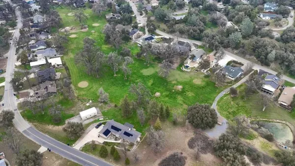 a sign that is sitting on a wooden wall