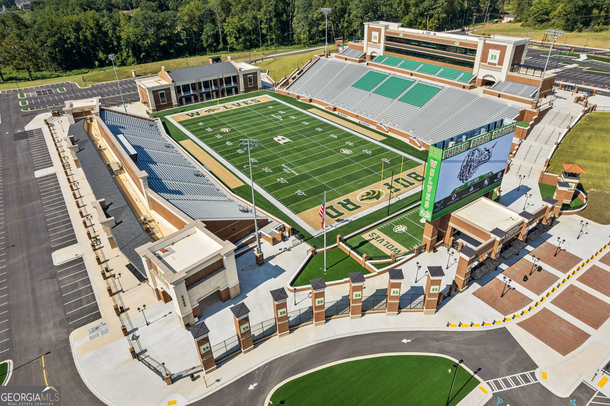 5388 Frazer Road Buford, GA 30518 - Photo 82 of 100 a view of a patio with table and chairs with wooden floor and fence