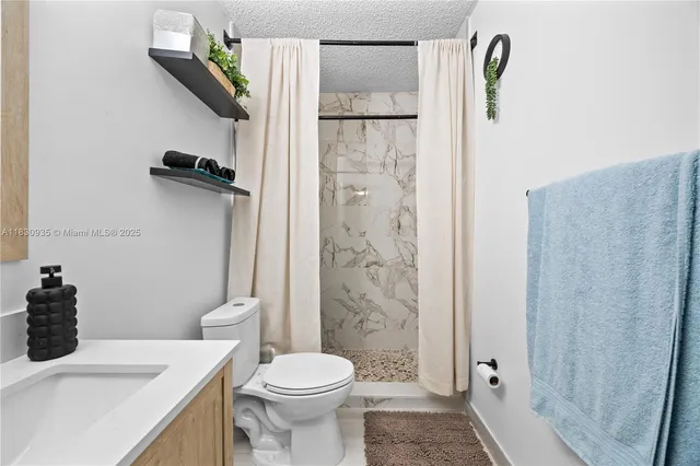 a bedroom with two beds and a closet