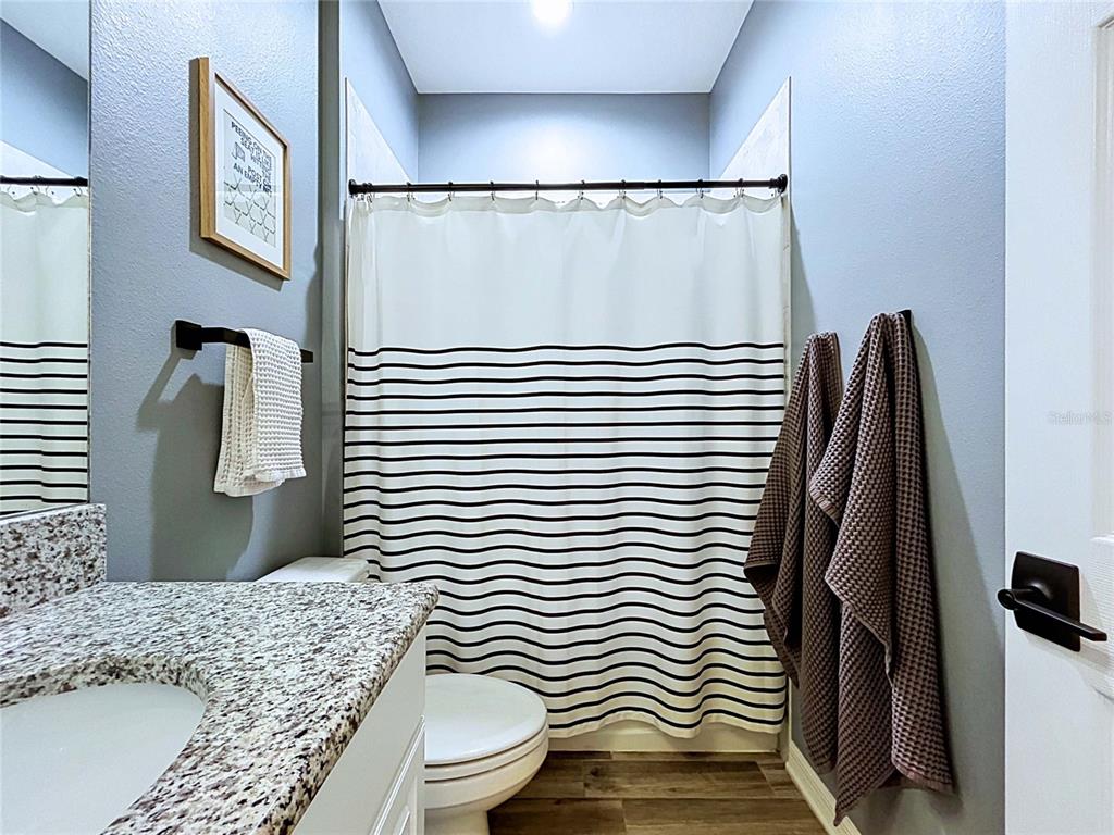 18078 Romanesque Court Spring Hill, FL 34610 - Photo 46 of 81 a bathroom with a sink toilet and shower