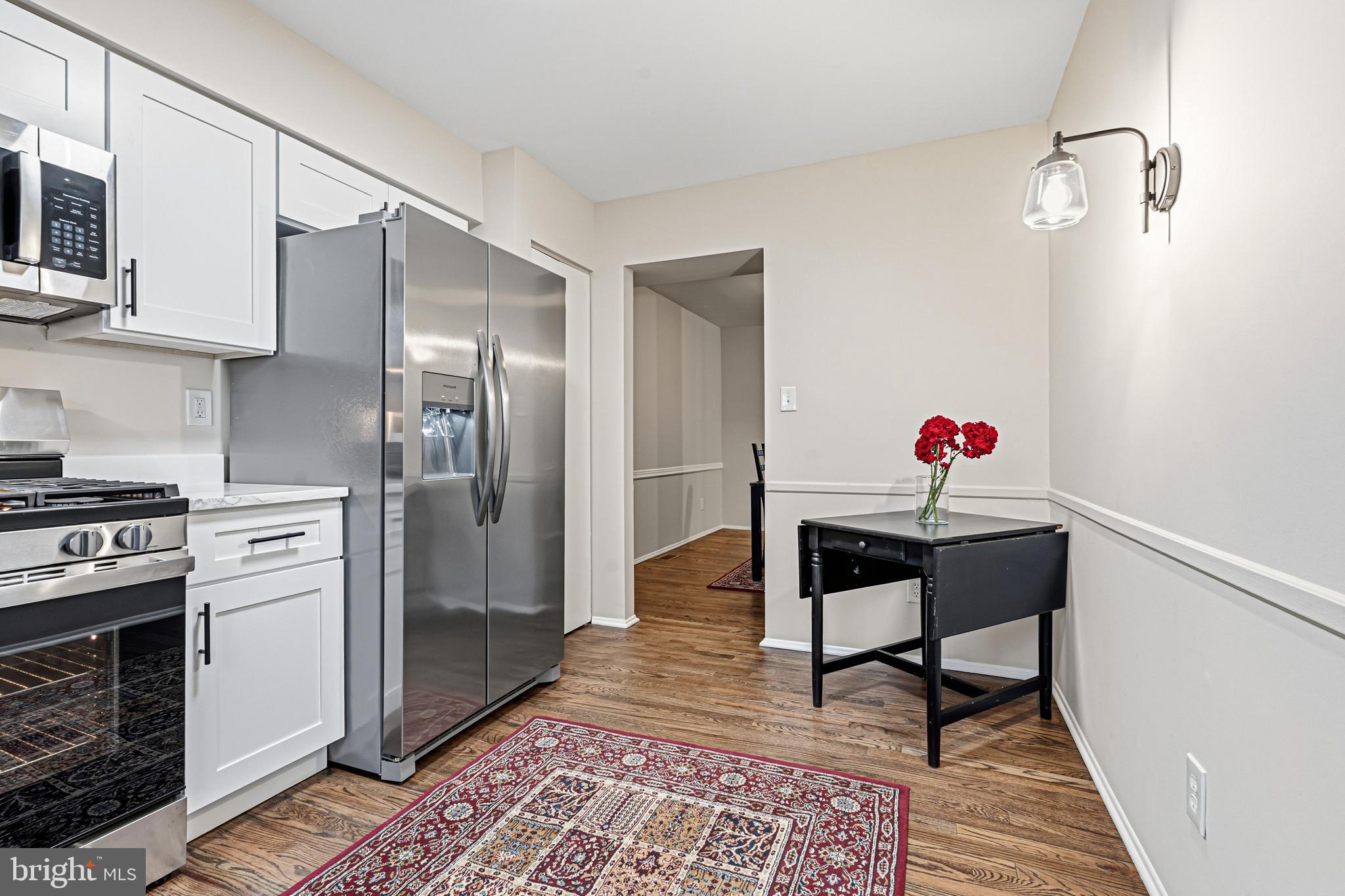 9 Menteith Court Baltimore, MD 21236 - Photo 11 of 46 a kitchen with stainless steel appliances granite countertop a refrigerator and a stove top oven