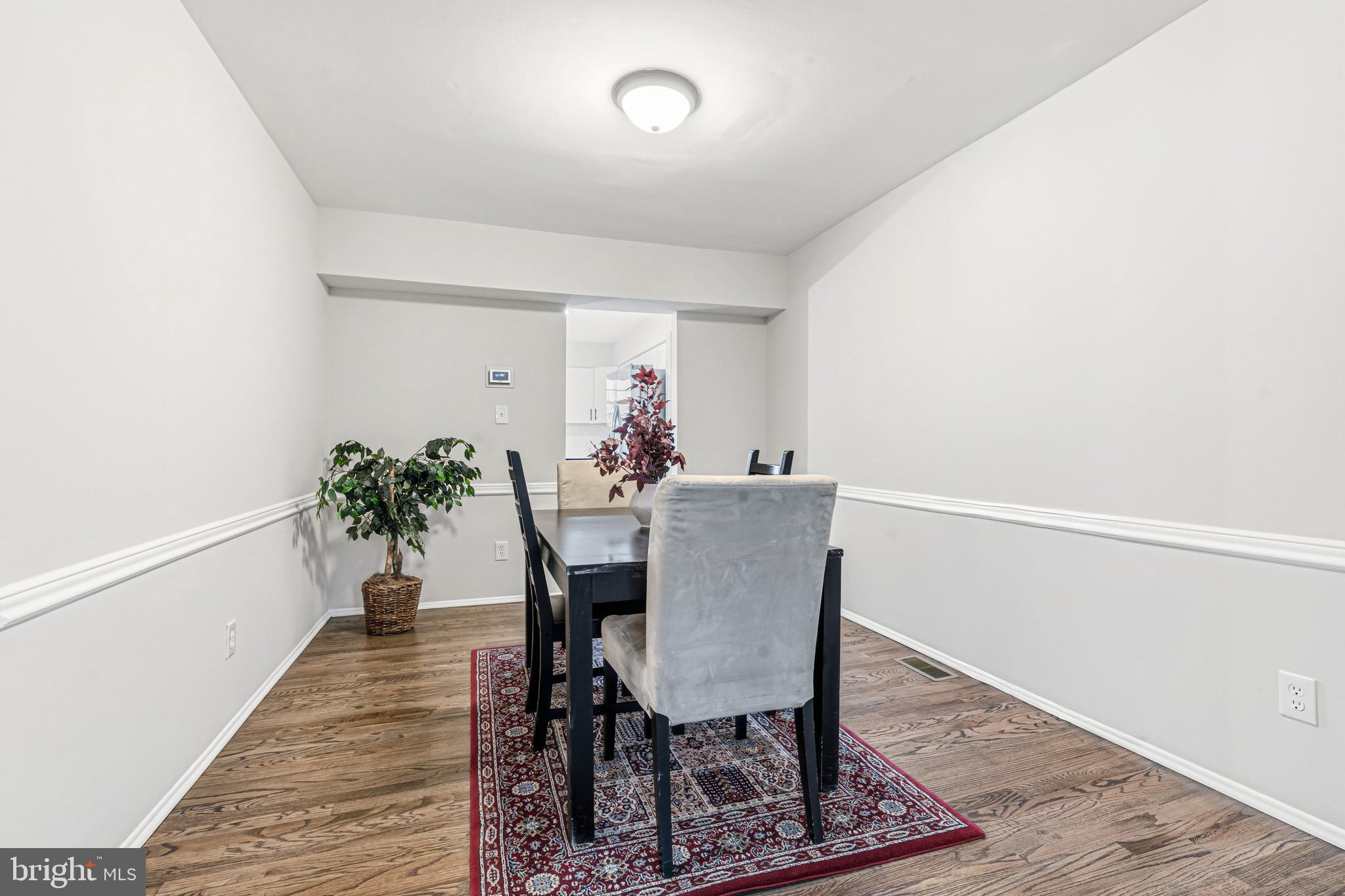 9 Menteith Court Baltimore, MD 21236 - Photo 13 of 46 a view of a dining room with furniture and wooden floor