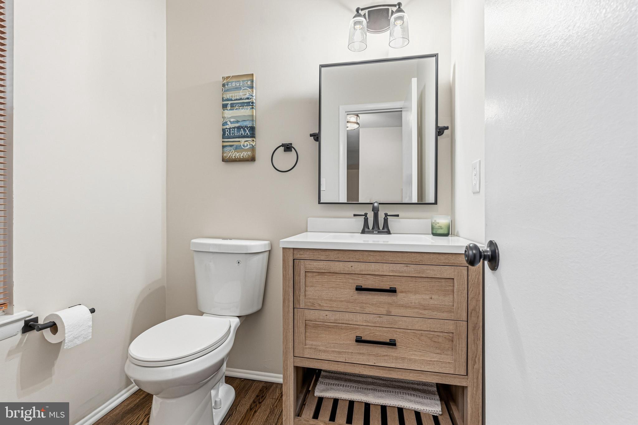 9 Menteith Court Baltimore, MD 21236 - Photo 17 of 46 a bathroom with a sink toilet and a mirror