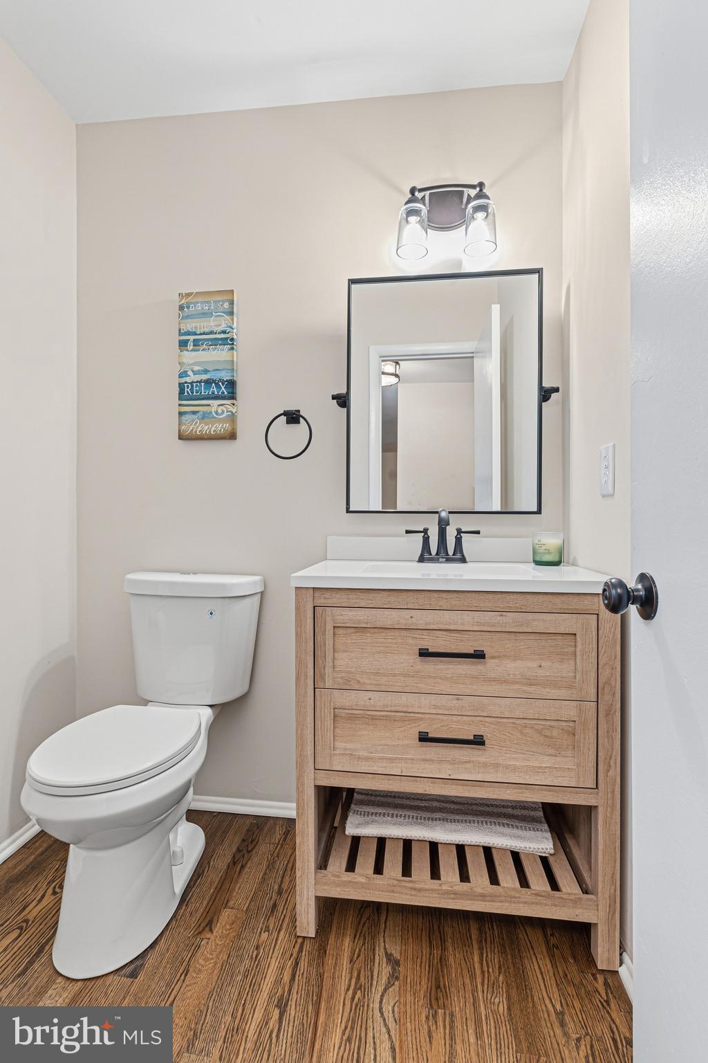 9 Menteith Court Baltimore, MD 21236 - Photo 18 of 46 a bathroom with a sink a toilet and mirror