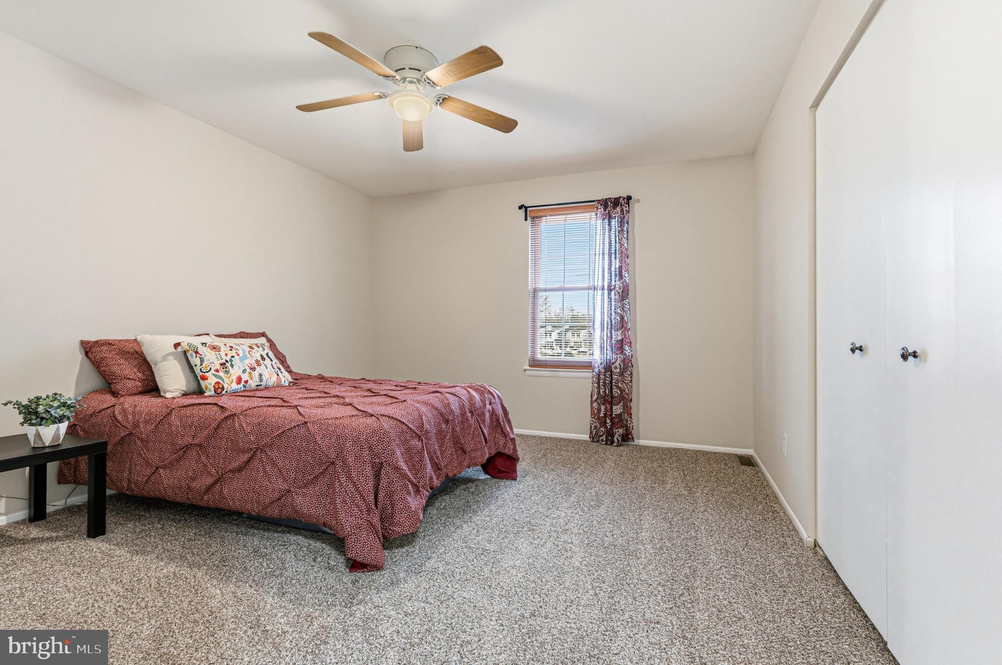 9 Menteith Court Baltimore, MD 21236 - Photo 25 of 46 a spacious bedroom with a bed and a window