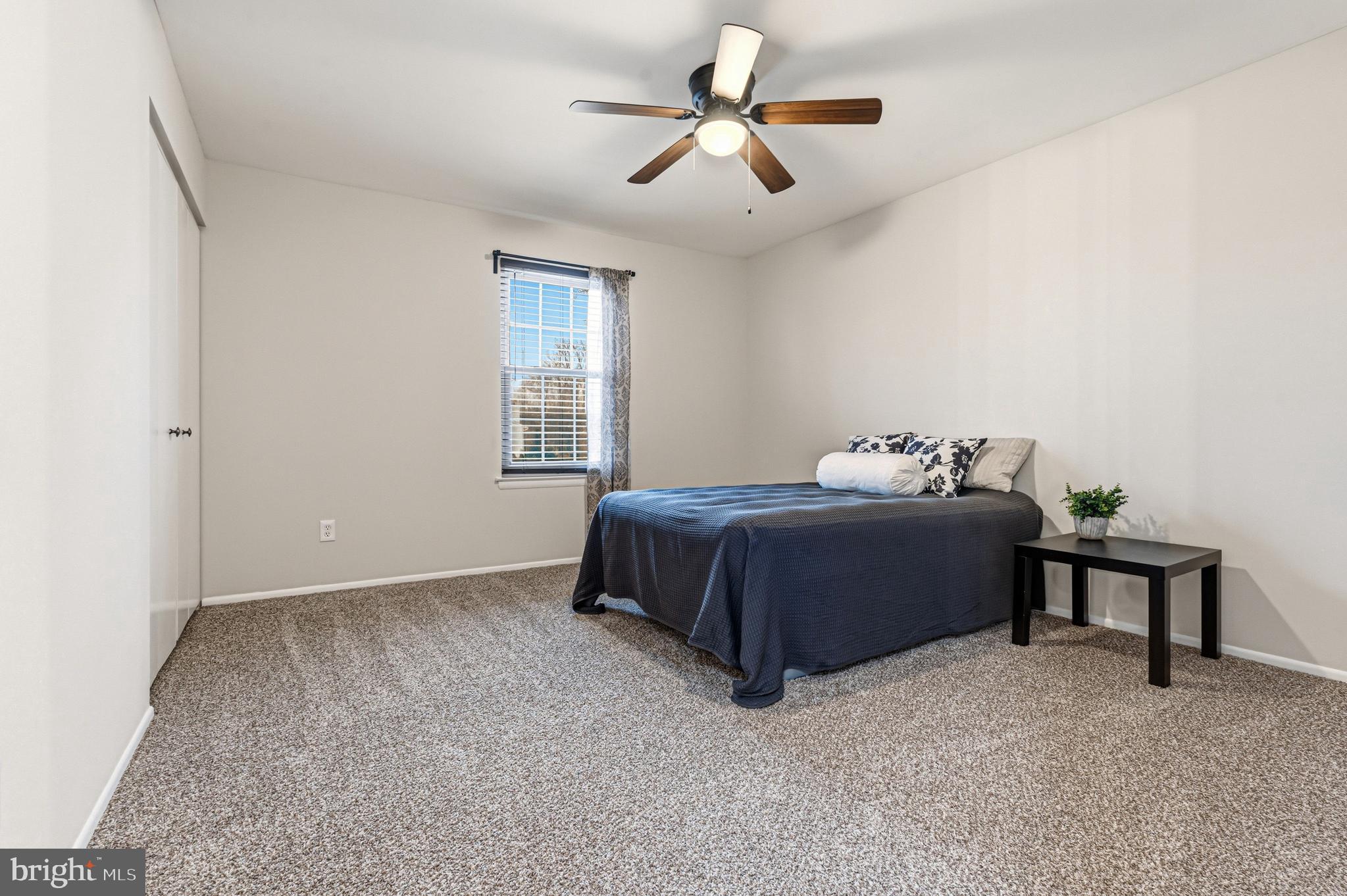 9 Menteith Court Baltimore, MD 21236 - Photo 29 of 46 a bedroom with a bed and a chandelier fan