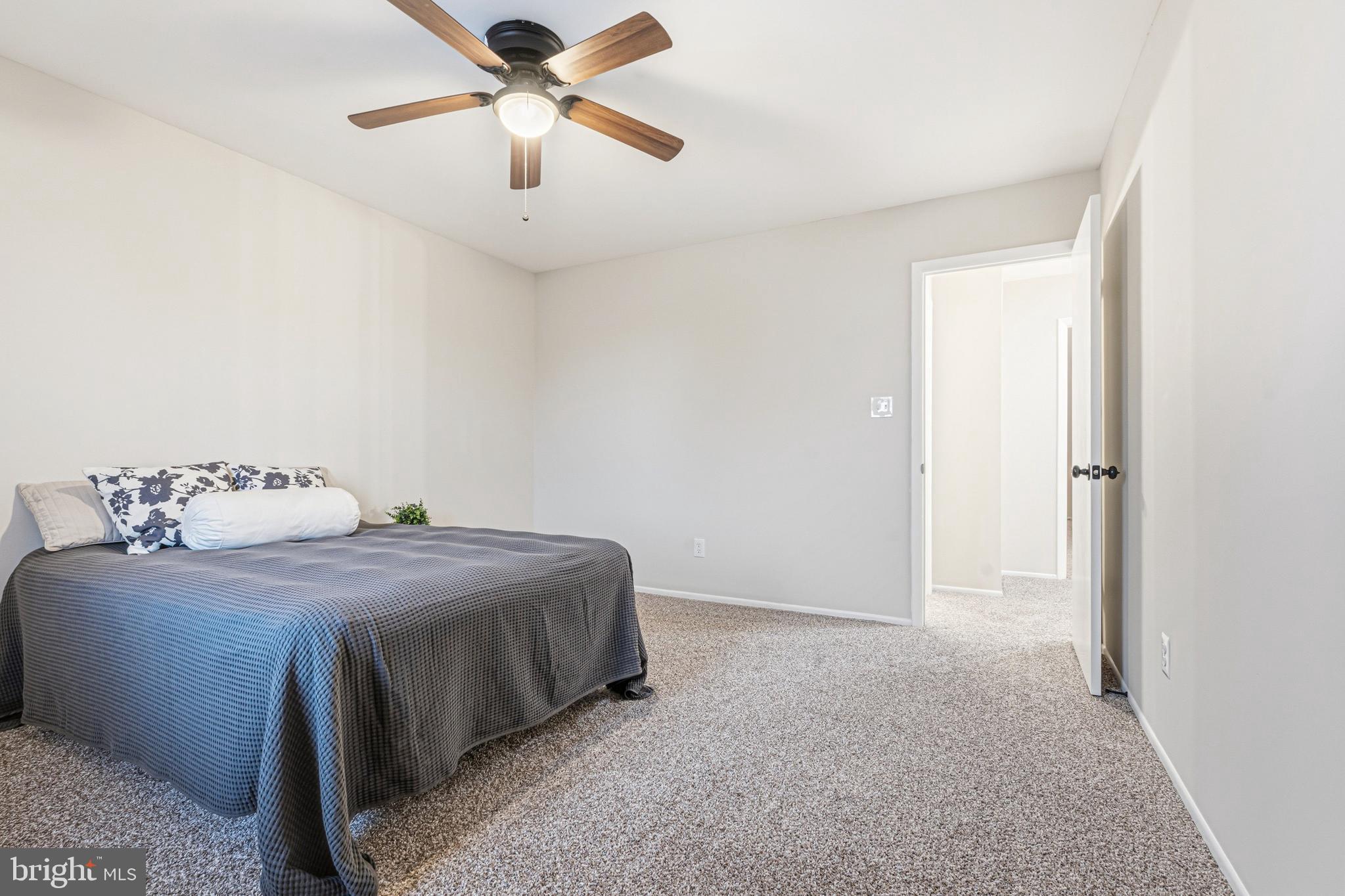 9 Menteith Court Baltimore, MD 21236 - Photo 30 of 46 a bedroom with a bed and a ceiling fan