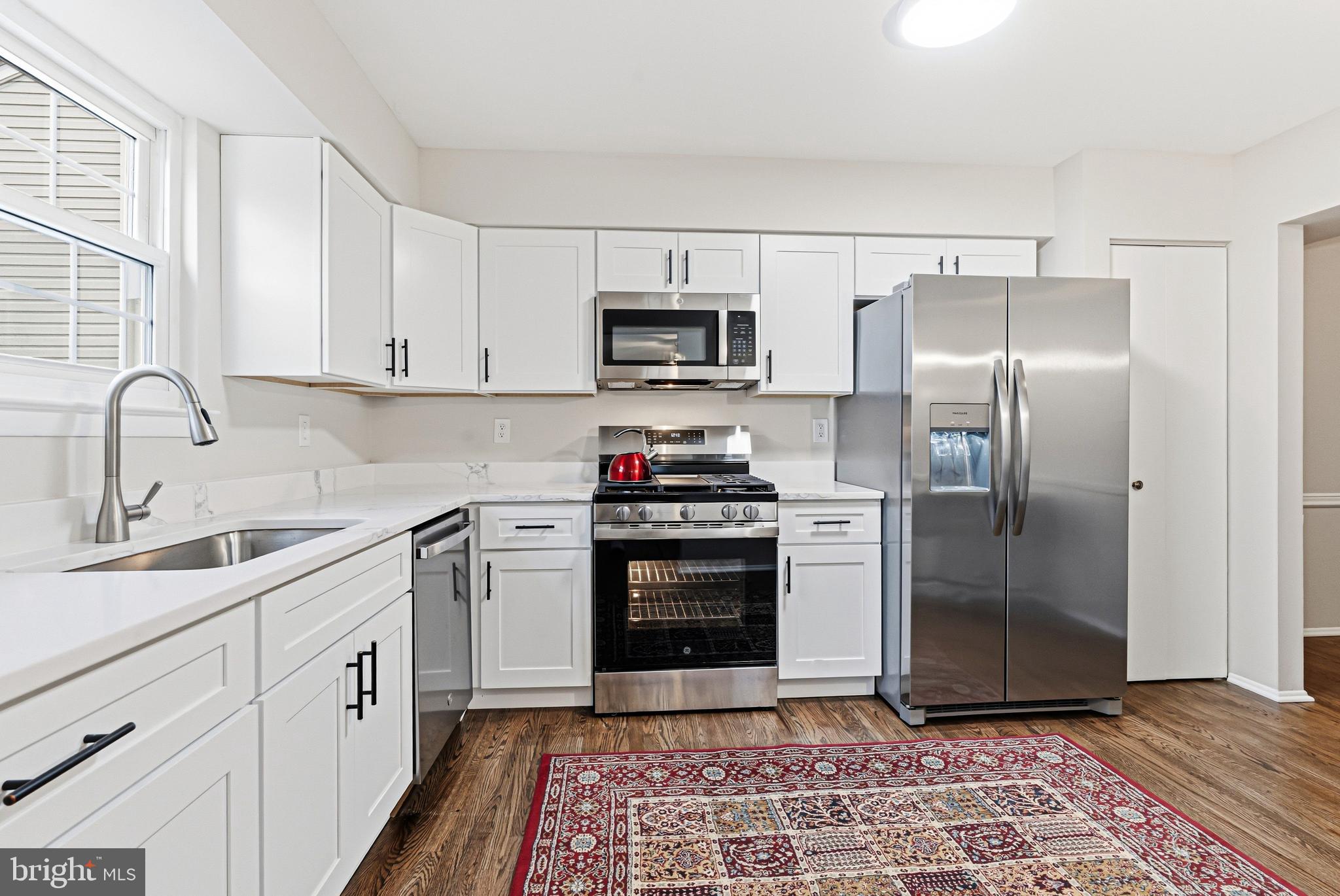 9 Menteith Court Baltimore, MD 21236 - Photo 8 of 46 a kitchen with a refrigerator stove and sink