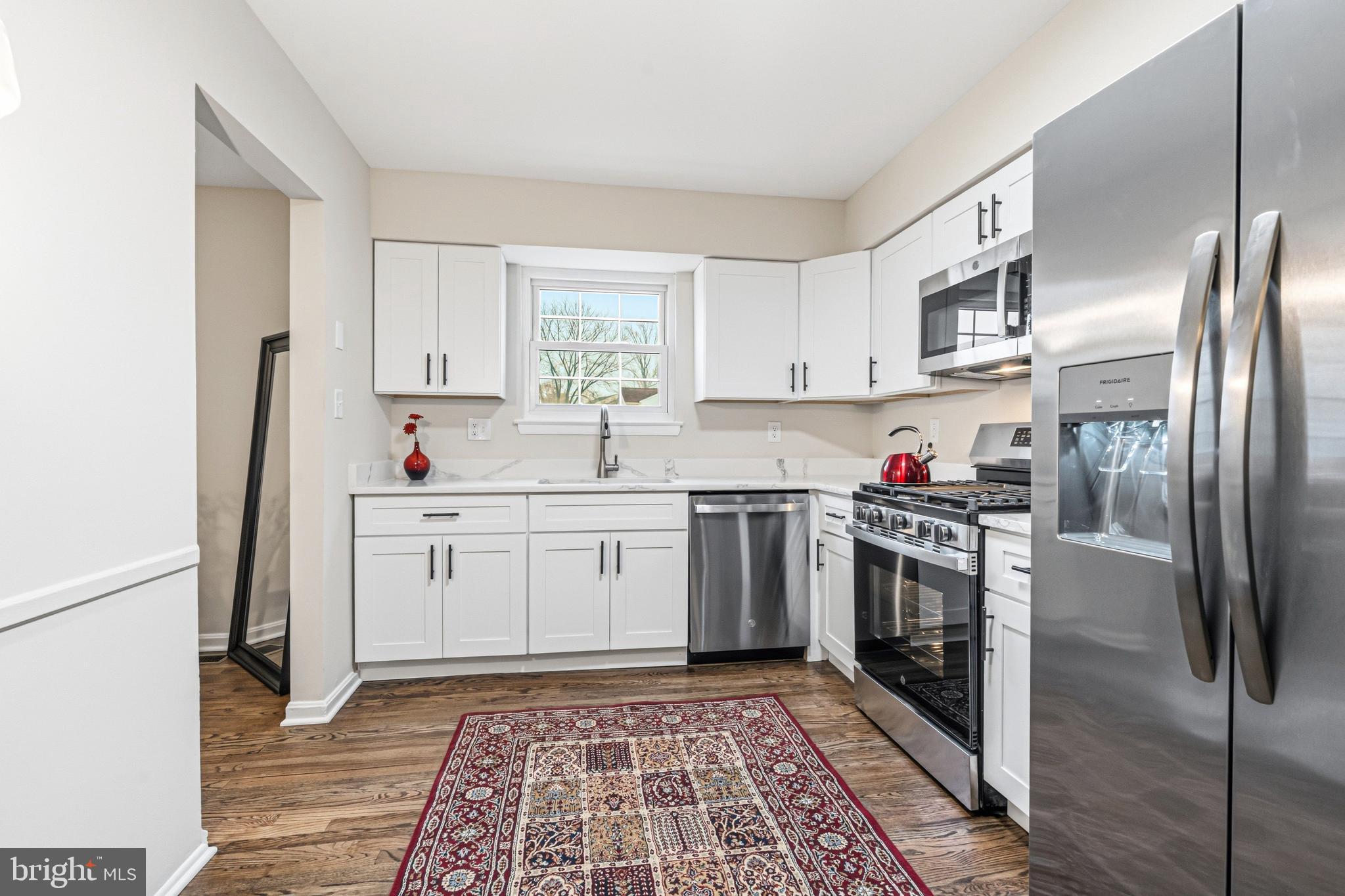 9 Menteith Court Baltimore, MD 21236 - Photo 10 of 46 a kitchen with granite countertop a sink stove and refrigerator