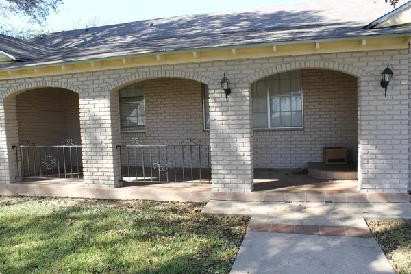 a front view of a house with large windows