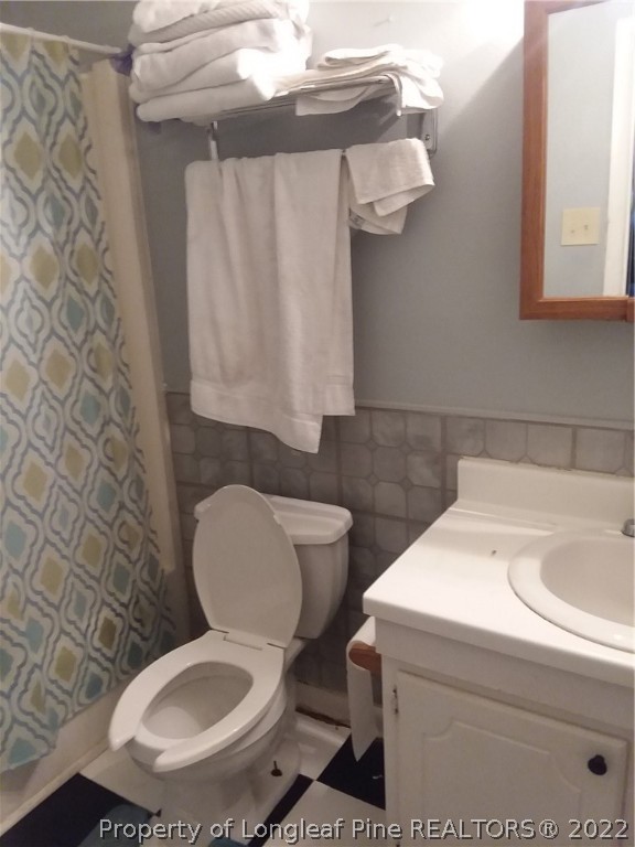 2560 Graham Road Fayetteville, NC 28304 - Photo 12 of 13 a bathroom with a toilet and a sink