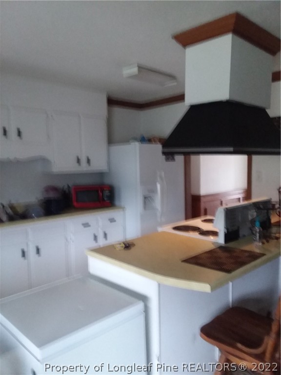 2560 Graham Road Fayetteville, NC 28304 - Photo 6 of 13 a kitchen with a sink a stove and a refrigerator