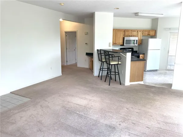 a view of kitchen with furniture and counter space