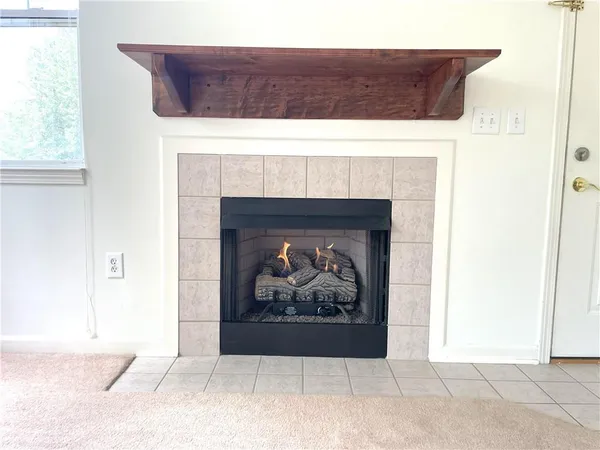 a view of a fireplace with a hallway