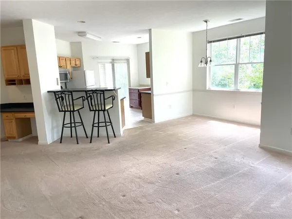 a view of a kitchen with furniture and a window