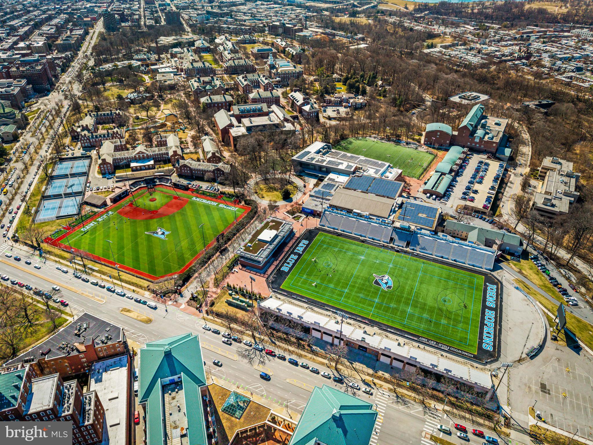 3801 Canterbury Road, Unit 1104 Baltimore, MD 21218 - Photo 65 of 74 an aerial view of a tennis ground and a lake view