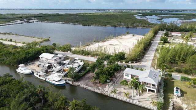 an aerial view of a house with a lake view