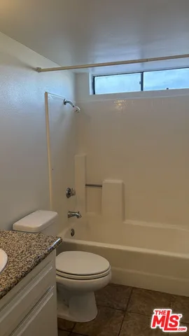 a bathroom with a shower and a bathtub