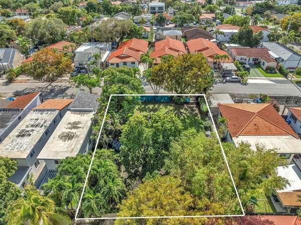 an aerial view of multiple houses with yard