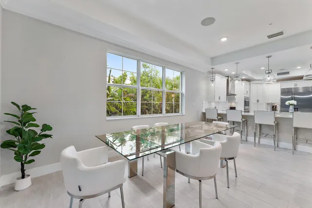 a bathroom with a granite countertop toilet sink and mirror