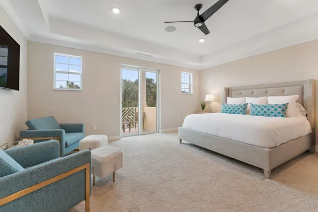 a bedroom with a bed and glass window