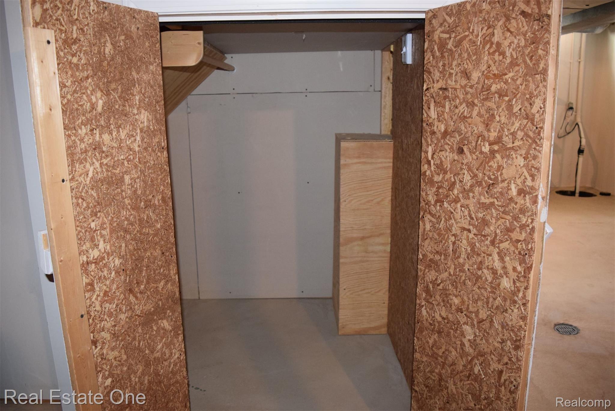 2706 Powderhorn Ridge Road Rochester, MI 48309 - Photo 33 of 48 Cedar closet under the stairs for clothing storage.