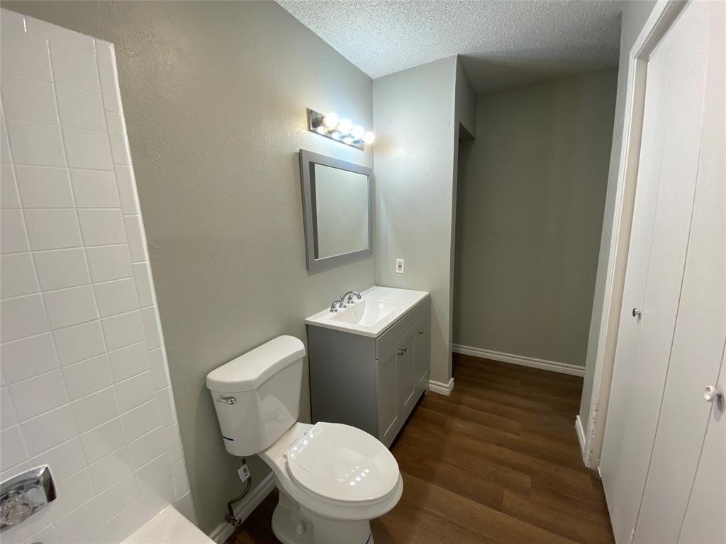 9696 Walnut Street, Unit 603 Dallas, TX 75243 - Photo 13 of 15 a white toilet sitting next to a bathroom sink