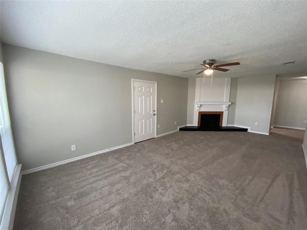 9696 Walnut Street, Unit 603 Dallas, TX 75243 - Photo 3 of 15 a view of empty room with a ceiling fan and window
