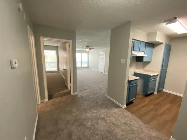 a kitchen with stainless steel appliances granite countertop a sink and a stove