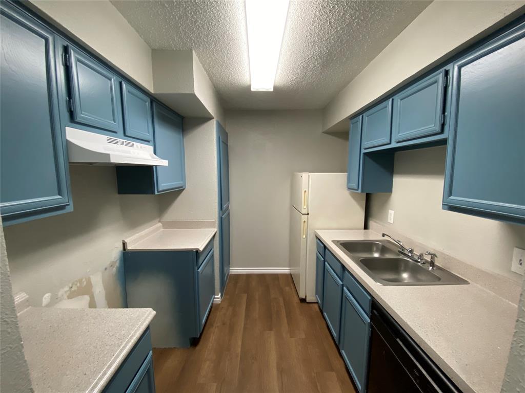 9696 Walnut Street, Unit 603 Dallas, TX 75243 - Photo 8 of 15 a kitchen with stainless steel appliances granite countertop a sink stove and refrigerator
