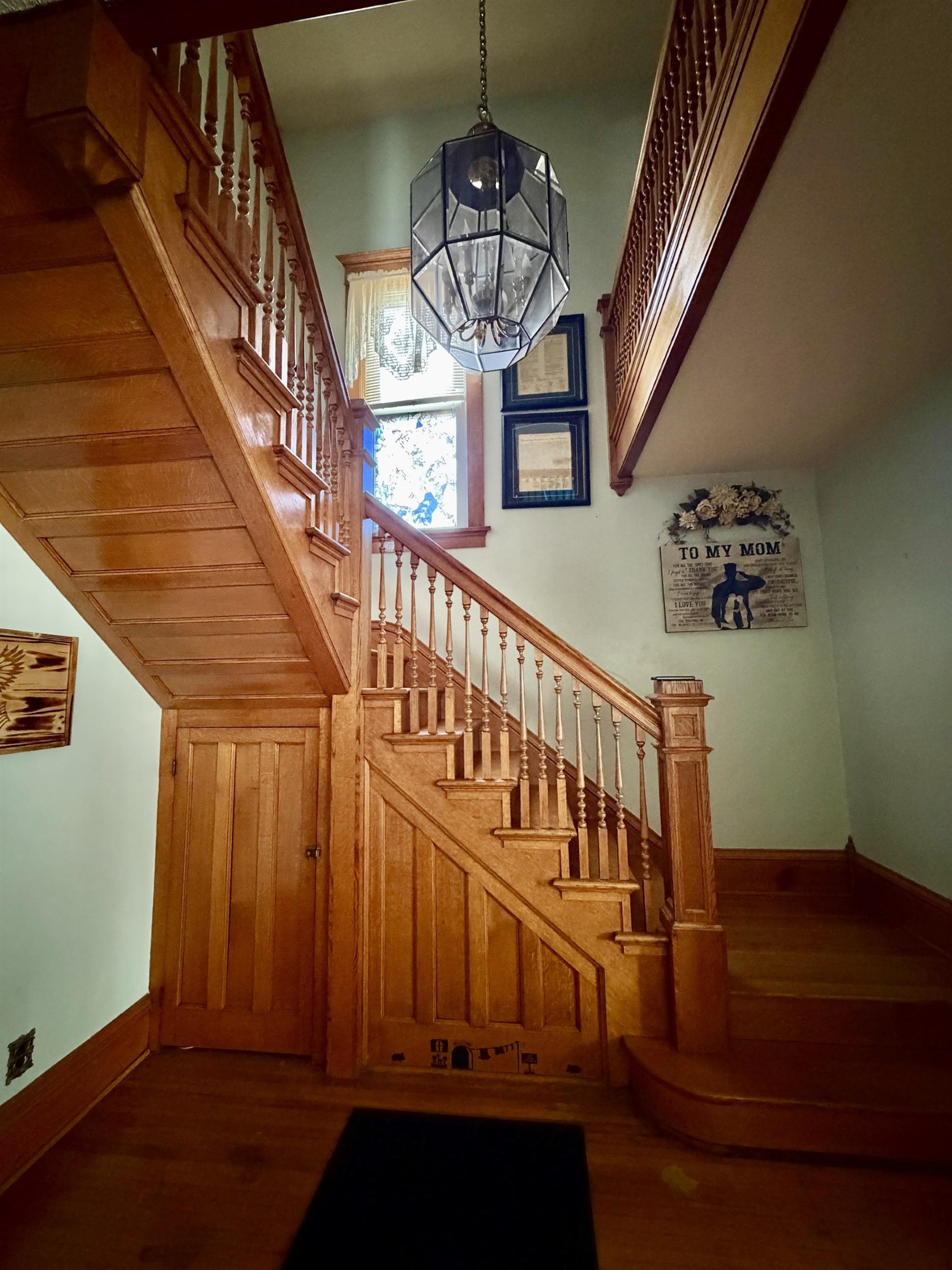 31 3rd Street Savanna, IL 61074 - Photo 13 of 42 a view of staircase with railing and a chandelier