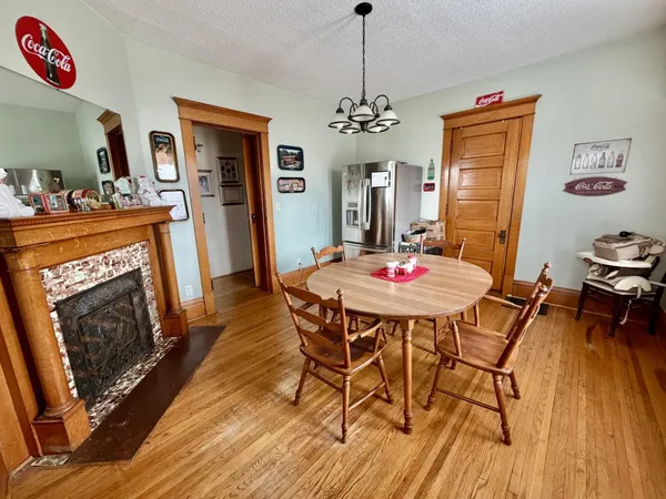 a dining room with furniture and window