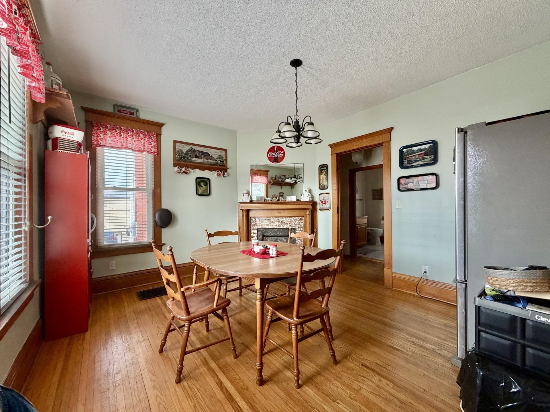 31 3rd Street Savanna, IL 61074 - Photo 18 of 42 a view of a dining room with furniture wooden floor and chandelier