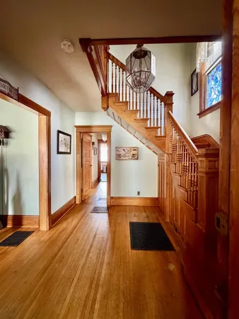 a view of entryway with wooden floor