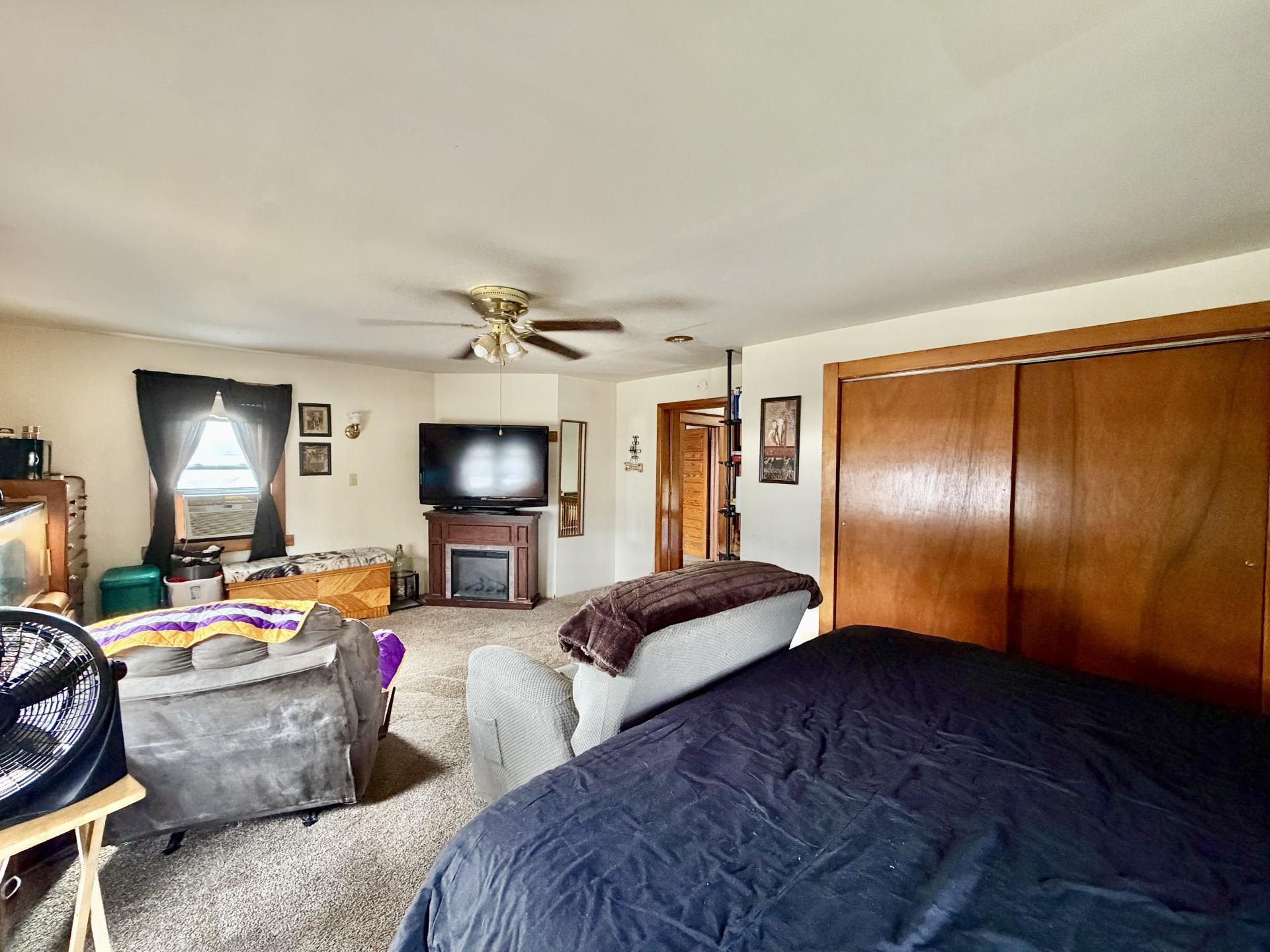 31 3rd Street Savanna, IL 61074 - Photo 28 of 42 a living room with furniture and a flat screen tv