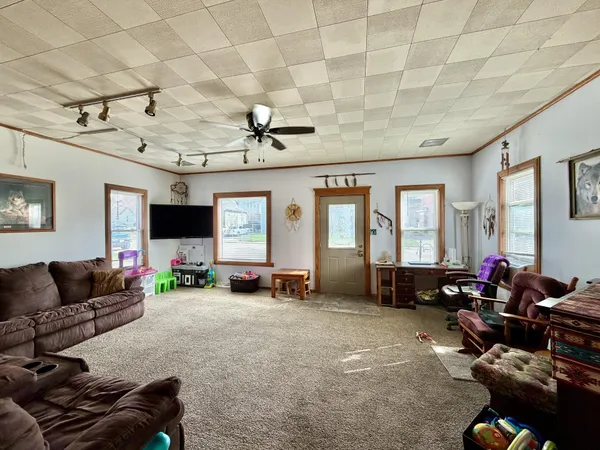 a living room with furniture and a flat screen tv