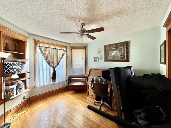 a view of a balcony with wooden floor