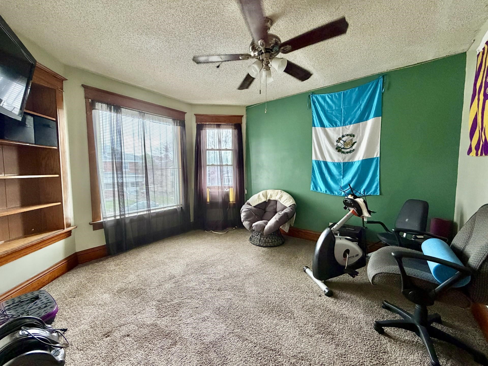 31 3rd Street Savanna, IL 61074 - Photo 34 of 42 a view of a room with gym equipment and a large window