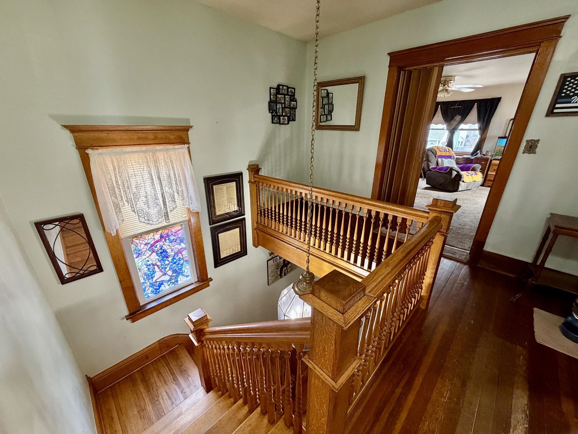 31 3rd Street Savanna, IL 61074 - Photo 35 of 42 a view of staircase with furniture and a window