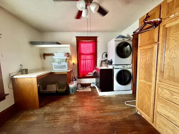 a room with furniture closet and flat screen tv