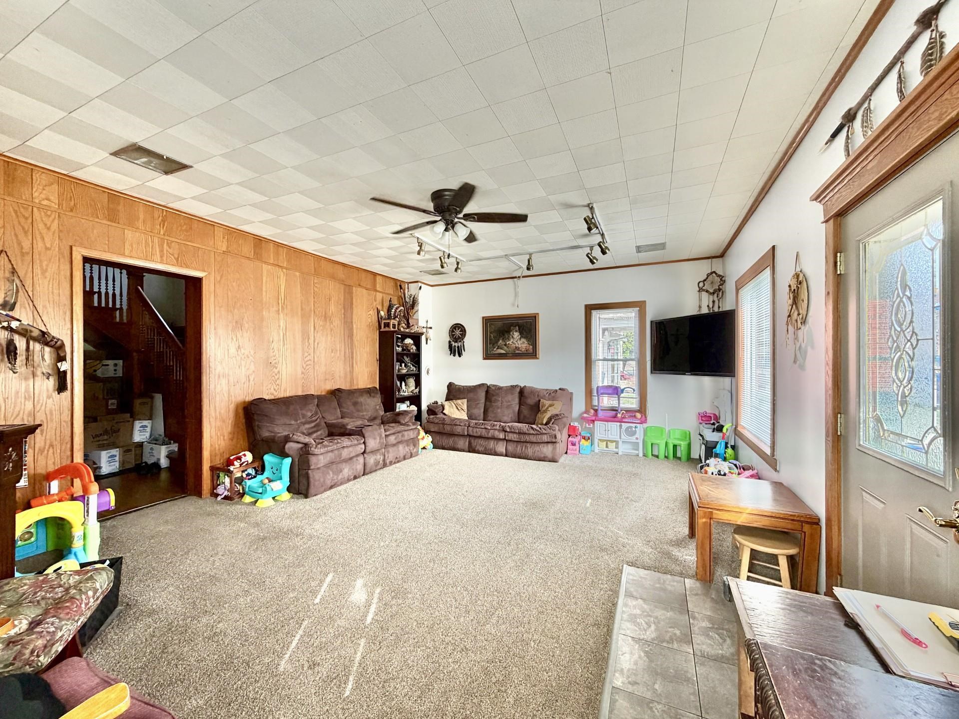 31 3rd Street Savanna, IL 61074 - Photo 6 of 42 a living room with furniture and a flat screen tv