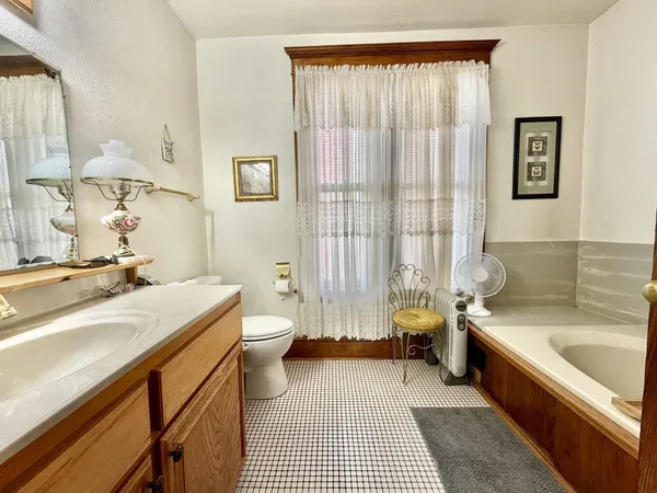 a room with a washing machine and sink