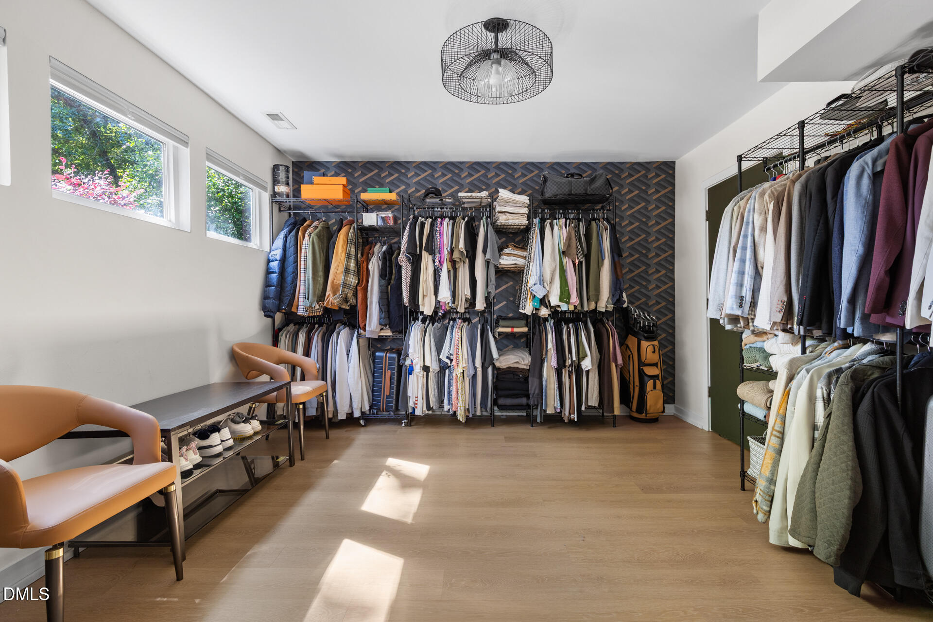 5208 Saddle Court Raleigh, NC 27609 - Photo 32 of 43 a view of walk in closet with clothes and shoes