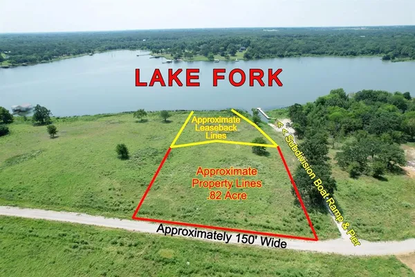 a view of swimming pool with a yard and lake view