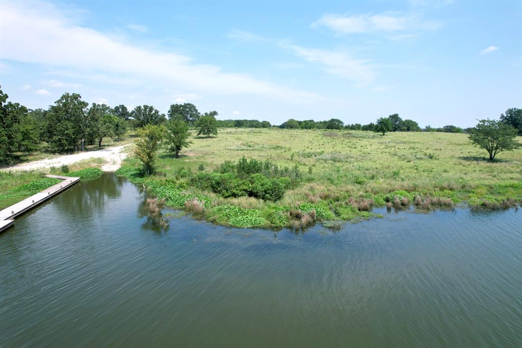 Lot 15 Anglers Point Drive Emory, TX 75440 - Photo 7 of 17 a view of a lake with houses in the back