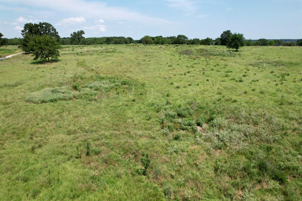 Lot 15 Anglers Point Drive Emory, TX 75440 - Photo 8 of 17 a view of a lake with a house in the background
