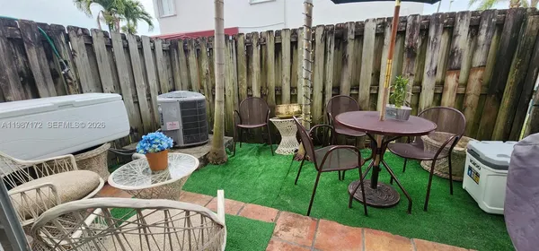 a view of outdoor kitchen with outdoor seating