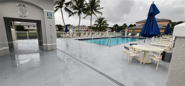 a view of outdoor kitchen with sitting area