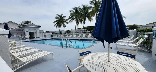 a view of a lake with houses in the back