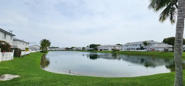 a view of a backyard with sitting area